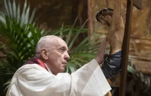 Pope Francis adores the crucifix during the Good Friday liturgy at St. Peter's Basilica April 2, 2021. Credit: Vatican Media